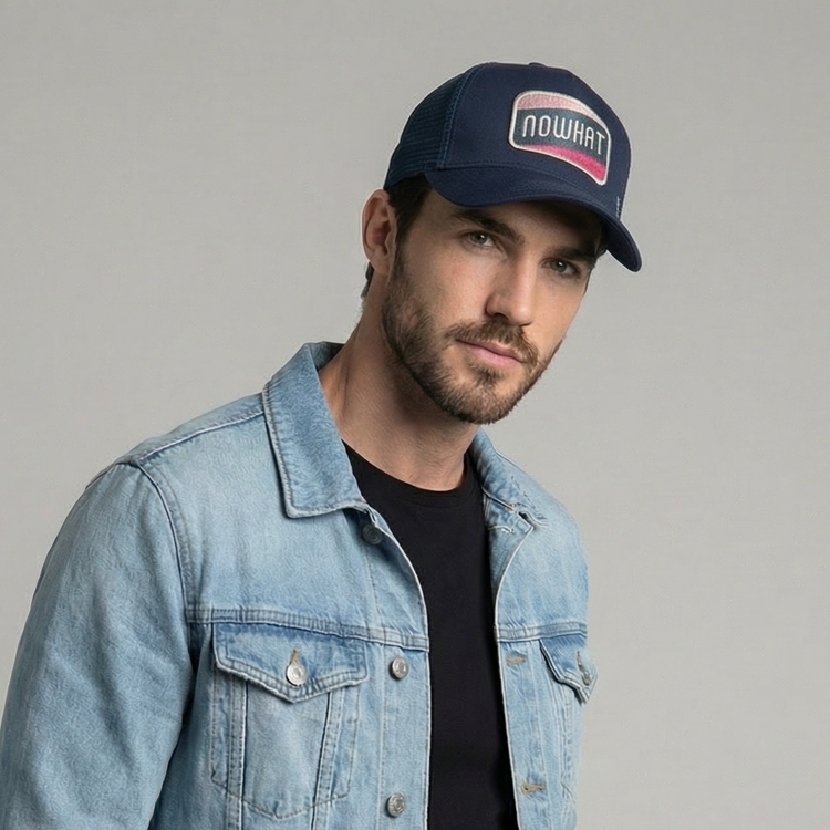 Now What Trucker Cap by Sand and Camels - model wearing the cap