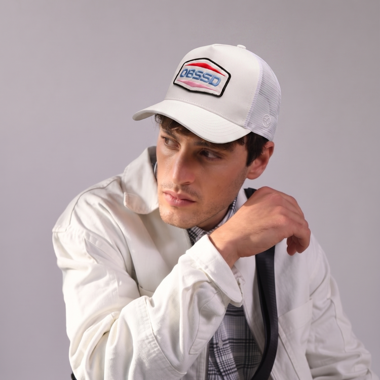 Obssd Trucker Cap by Sand and Camels - model wearing the cap