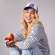 sand and camels, bad apple, fruit collection, trucker hat, cap, a smiling woman, product